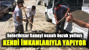 Seferihisar Sanayi esnafı bozuk yolları kendi imkanlarıyla yapıyor