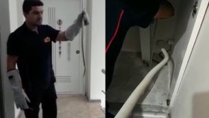 Çamaşır makinesinin arkasındakini görünce itfaiyeden yardım istedi