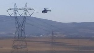 Helikopterin yüksek gerilim hattına takıldığı ihbarı ekipleri alarma geçirdi