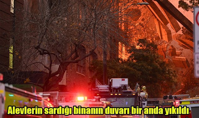 Alevlerin sardığı binanın duvarı bir anda yıkıldı