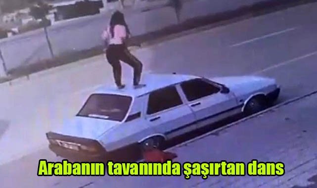 Arabanın tavanında şaşırtan dans