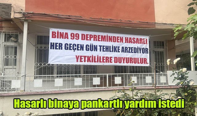 Hasarlı binaya pankartlı yardım istedi