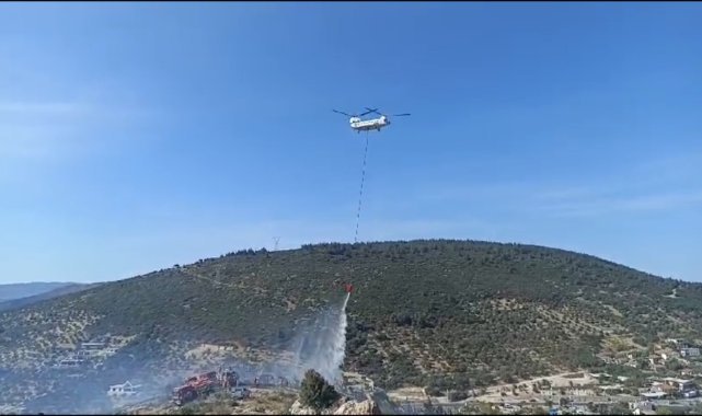 Foça'da bir depoda başlayan ve ormanlık alana sıçrayan yangın söndürüldü